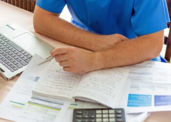 Travel nurse going through receipts of duplicate expenses