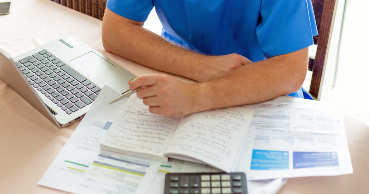 Travel nurse going through receipts of duplicate expenses