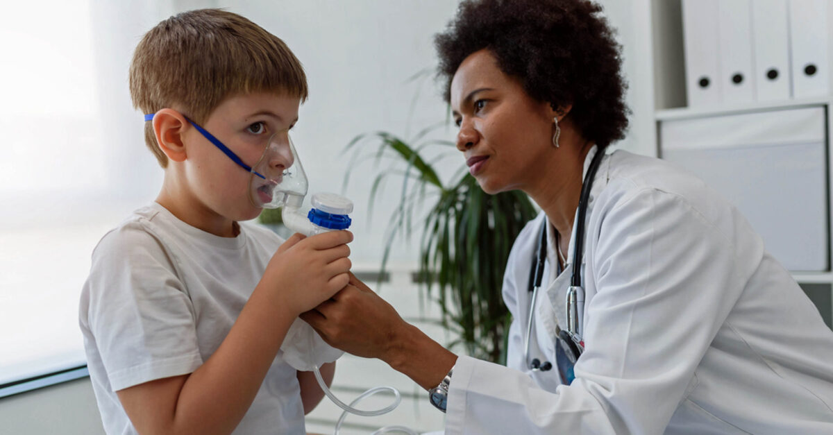 Respiratory therapist with child