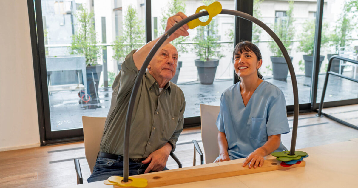 Occupational therapist working with senior patient