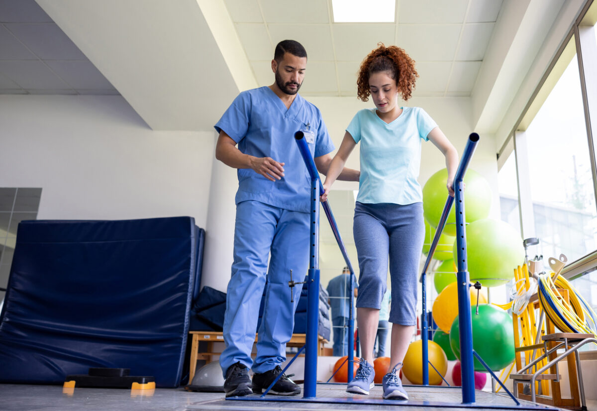 Occupational or physical therapist working with a patient