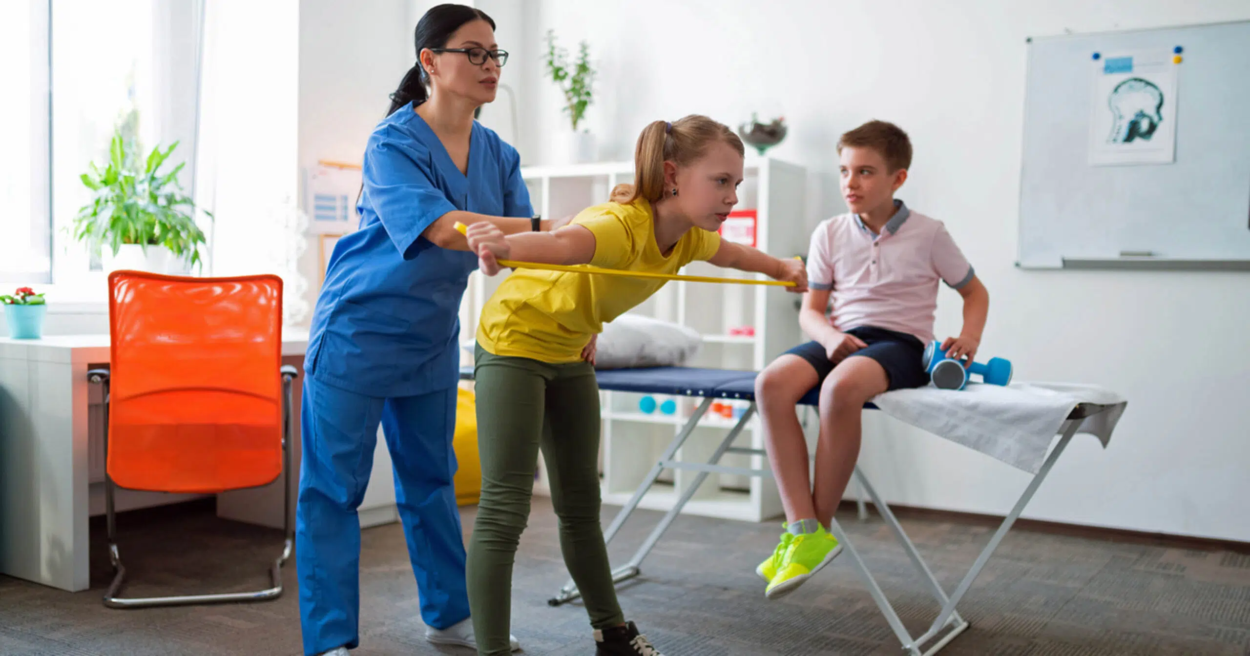 Physical therapist working with kids