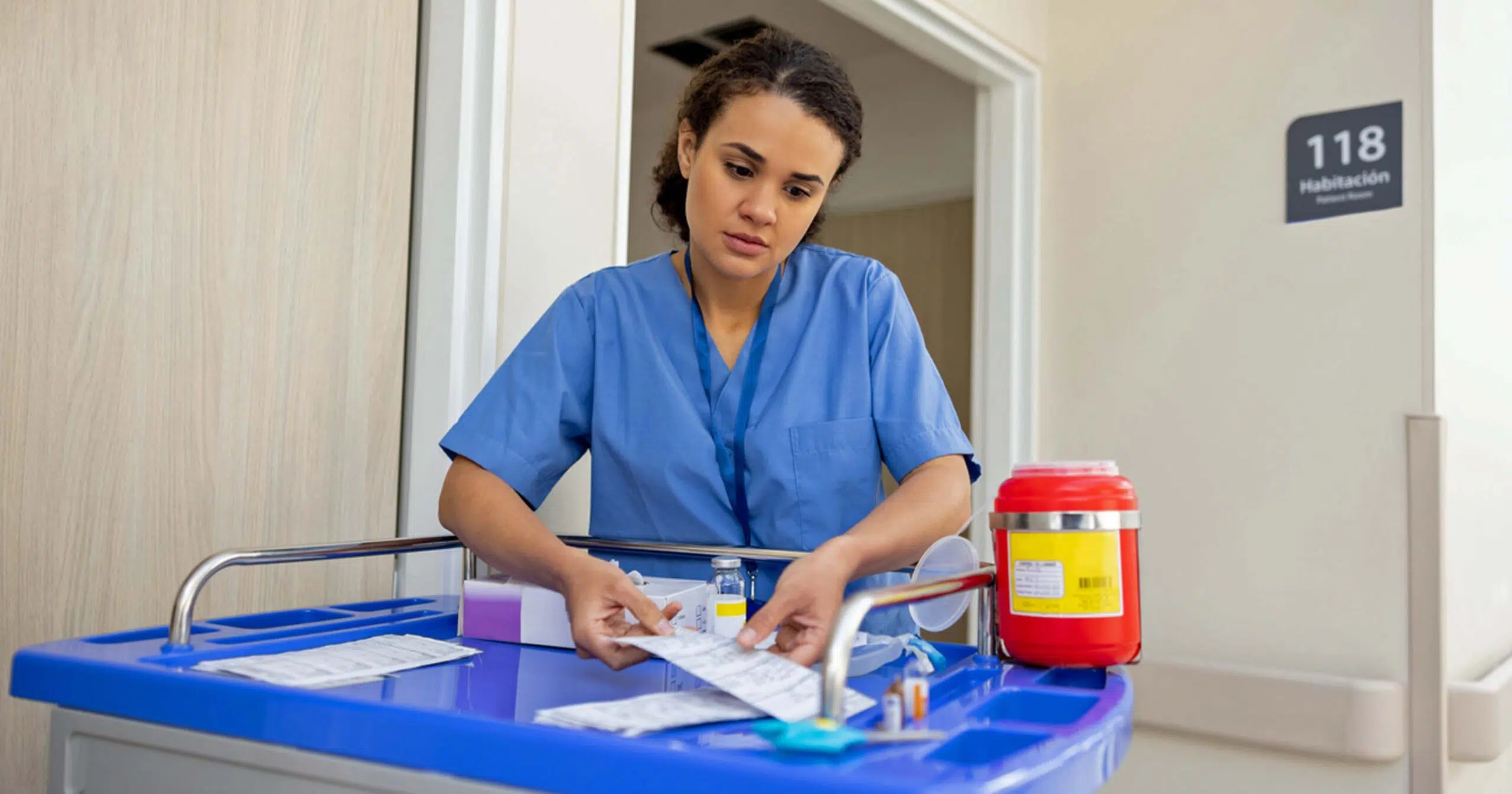 Nurse dispensing medicine in hospital rooms