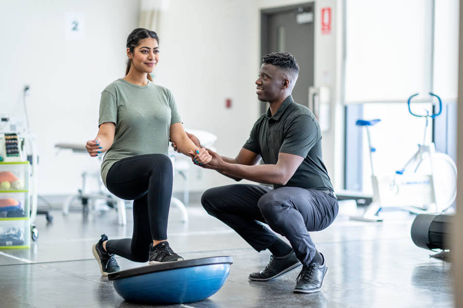 Male Physical Therapist working with patient