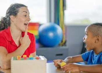 speech language pathologist working with young patient