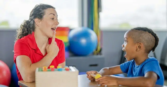 speech language pathologist working with young patient