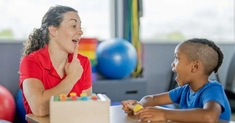 speech language pathologist working with young patient