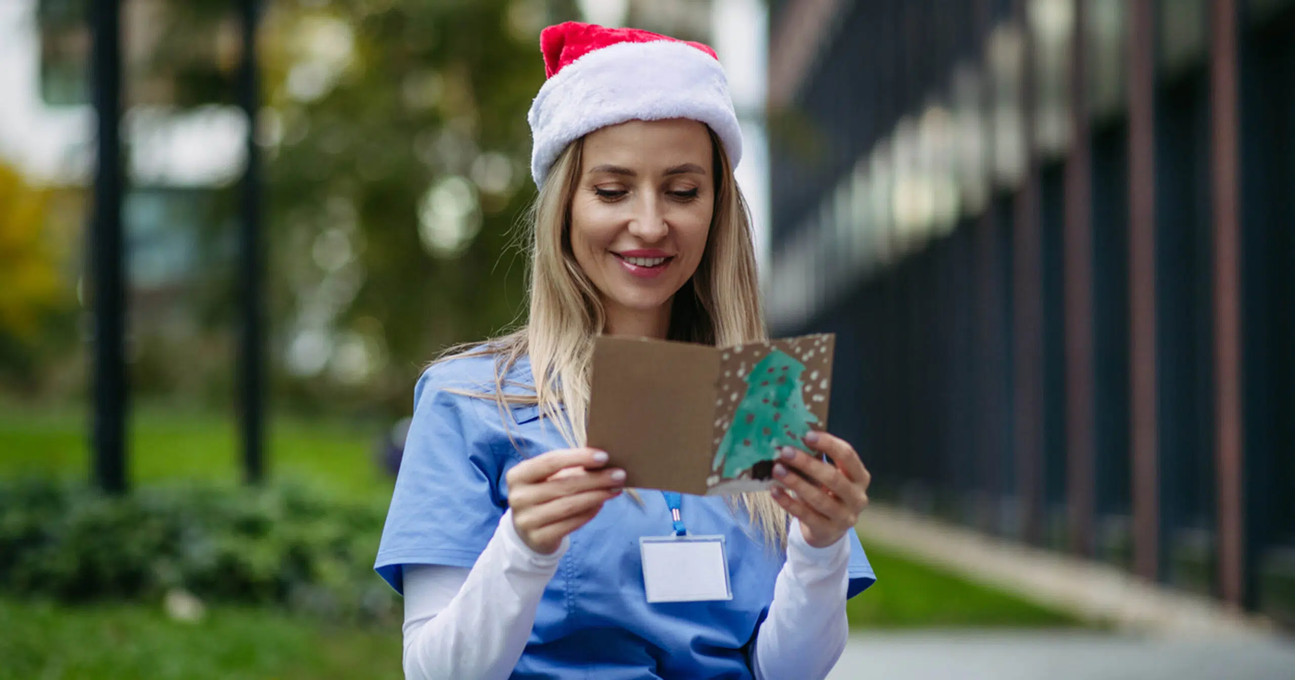 Nurse reading card from patient